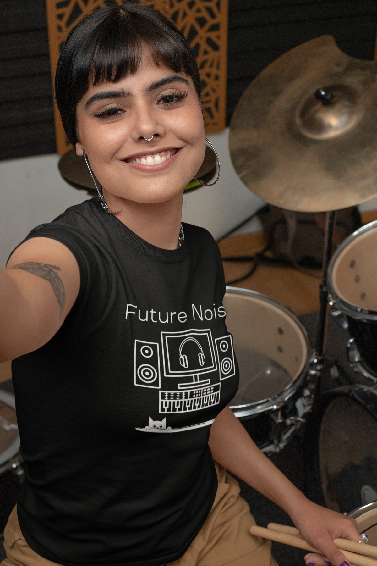 A model wearing a black crew neck t-shirt with 'Future Noise' text and a graphic of a cat and some music studio equipment.