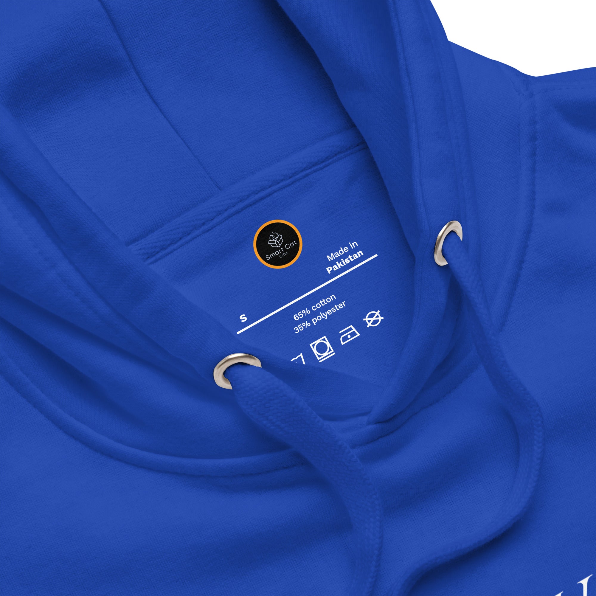 Close-up of Smart Cat Gifts neck label on royal blue Grit City Tribe hoodie with care symbols.