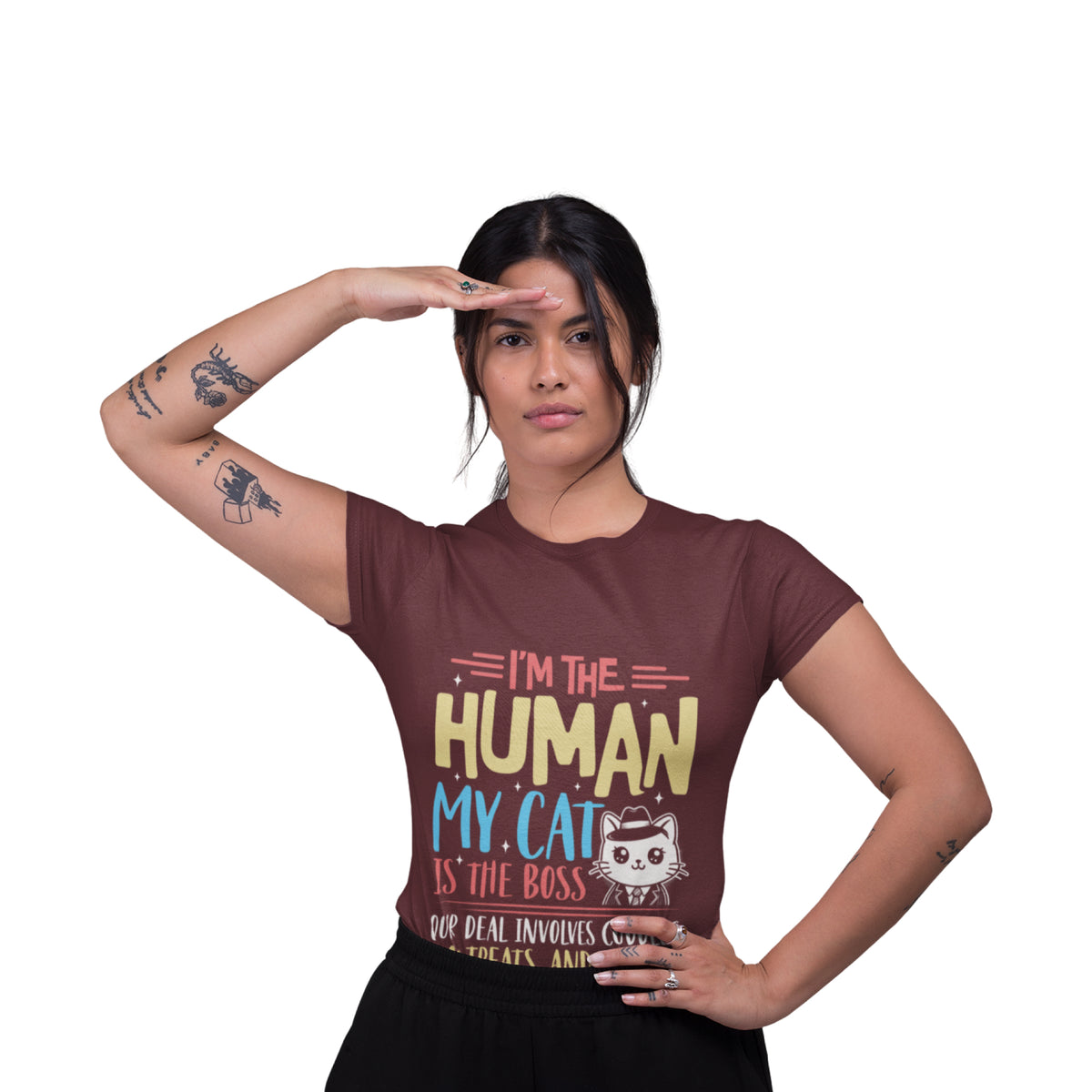 A woman posing in a maroon graphic t-shirt with the text 'I'M THE HUMAN MY CAT IS THE BOSS' and a cartoon cat wearing a hat, set against a plain white background.