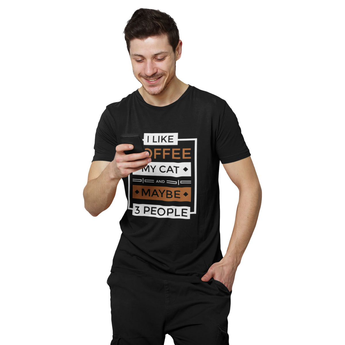 A man wearing a black graphic t-shirt with the text 'I LIKE COFFEE MY CAT MAYBE 3 PEOPLE' in white and orange, holding a phone against a plain white background.