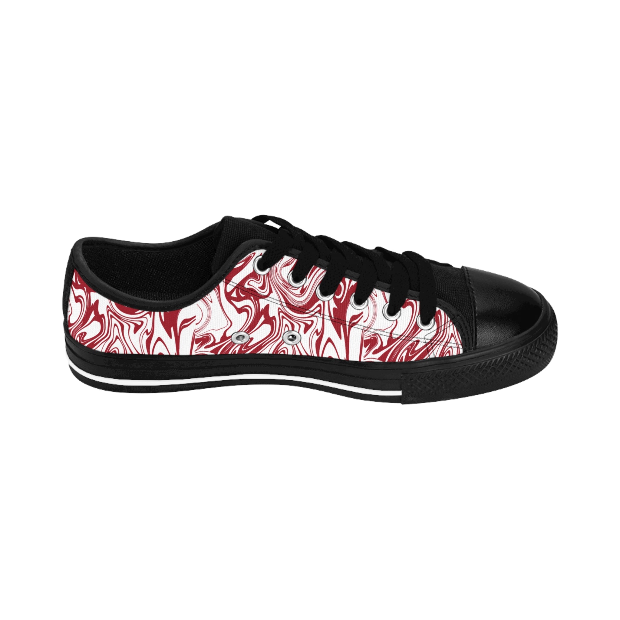 Inside view of the Candy Swirl women's sneakers: white with red swirl all-over print, two black paw prints on heel.