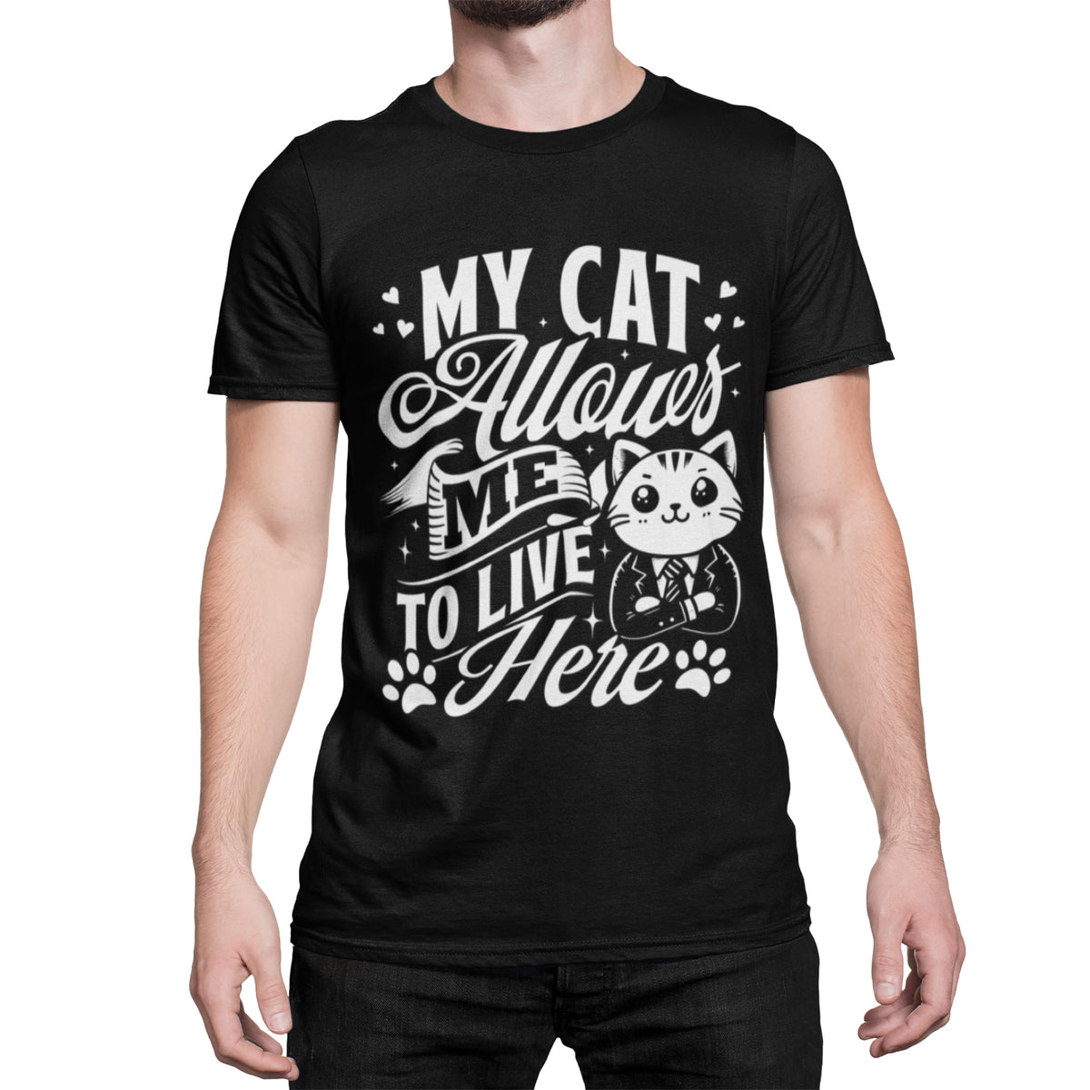 A man wearing a black short-sleeve t-shirt with a white graphic print that reads 'MY CAT Allows ME TO LIVE HERE' alongside a cartoon cat in a suit.
