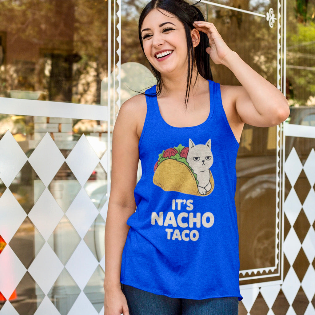 Model wearing royal blue racerback tank with It's Nacho Taco cat design outside a shop window