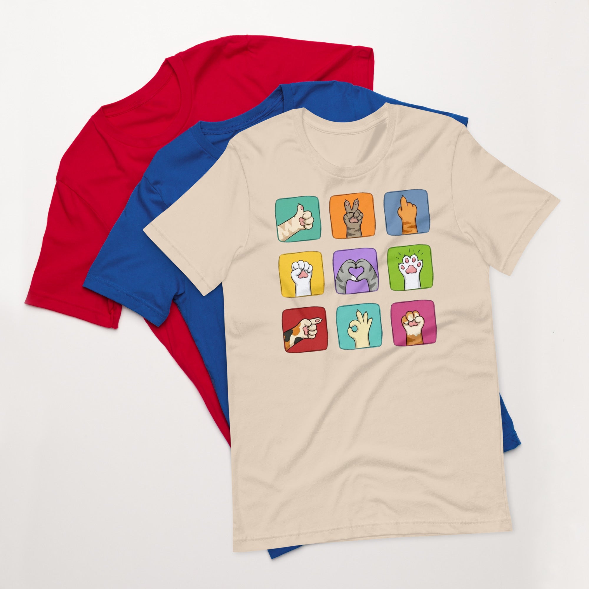 Natural t-shirt with colorful paw signals graphic, flat lay with red umbrella