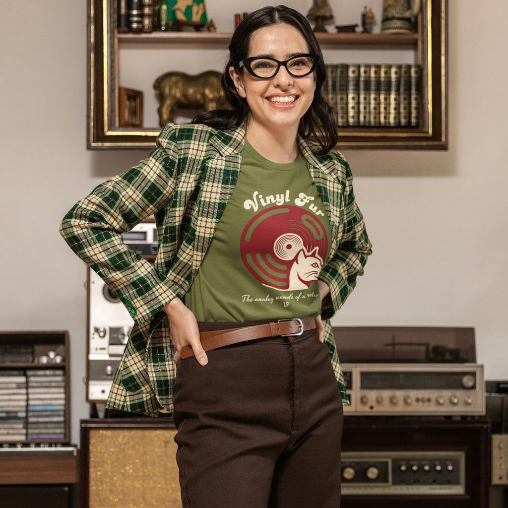Model wearing olive green tee with red vinyl record and cat graphic