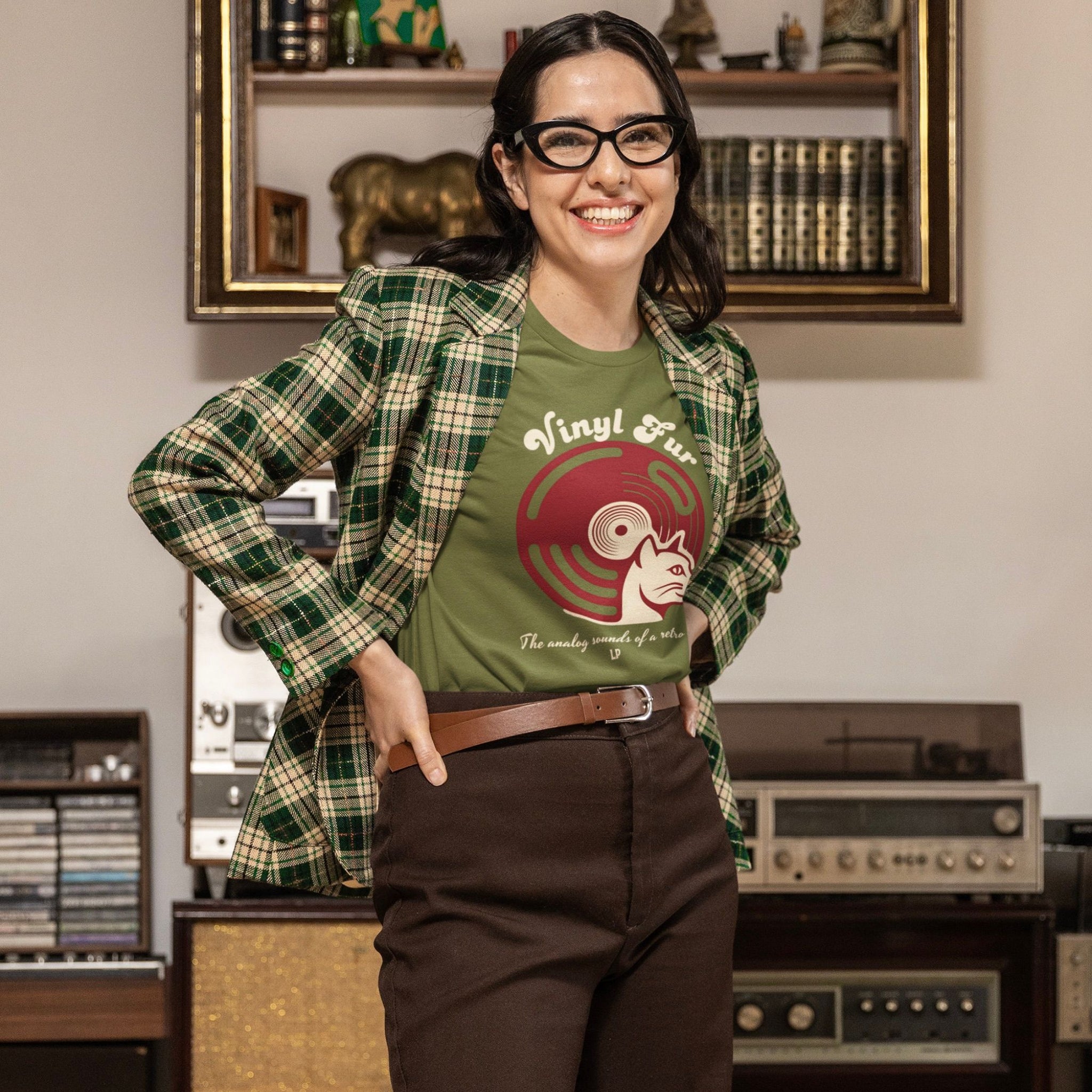 Model wearing olive green tee with red vinyl record and cat graphic