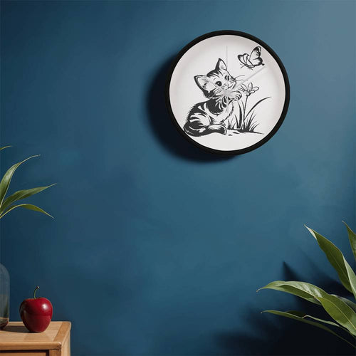  A clock featuring a line art design of a playful encounter between a curious kitten and a gentle butterfly