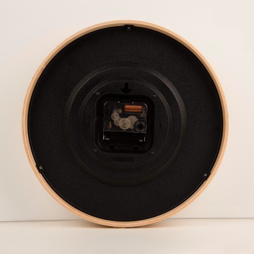 Back view of a clock, showcasing the battery slot and preinstalled hook.