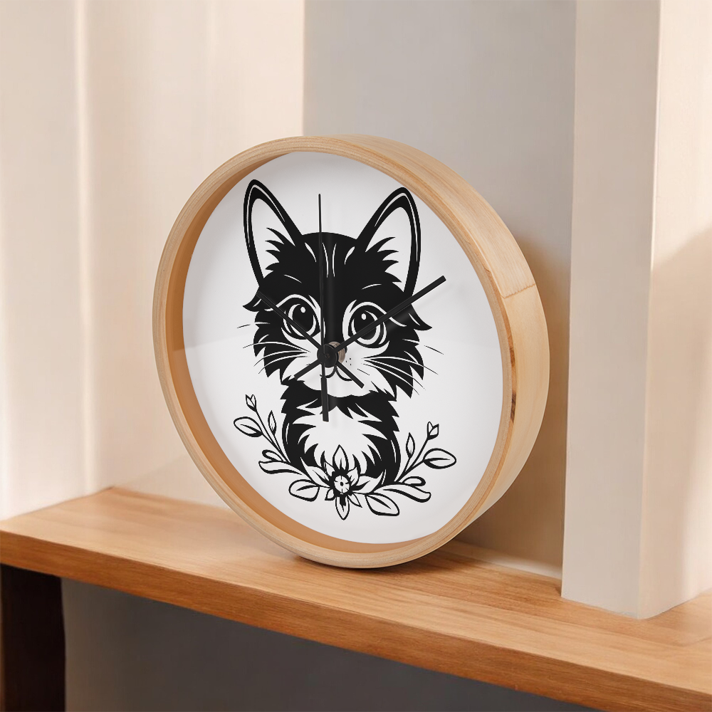 Black and white line art of a kitten sitting among flowers on a 10" wood frame "Purfect Timing" clock.