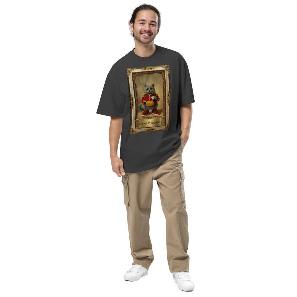 Model wearing black oversized faded tee with vintage portrait graphic, studio view