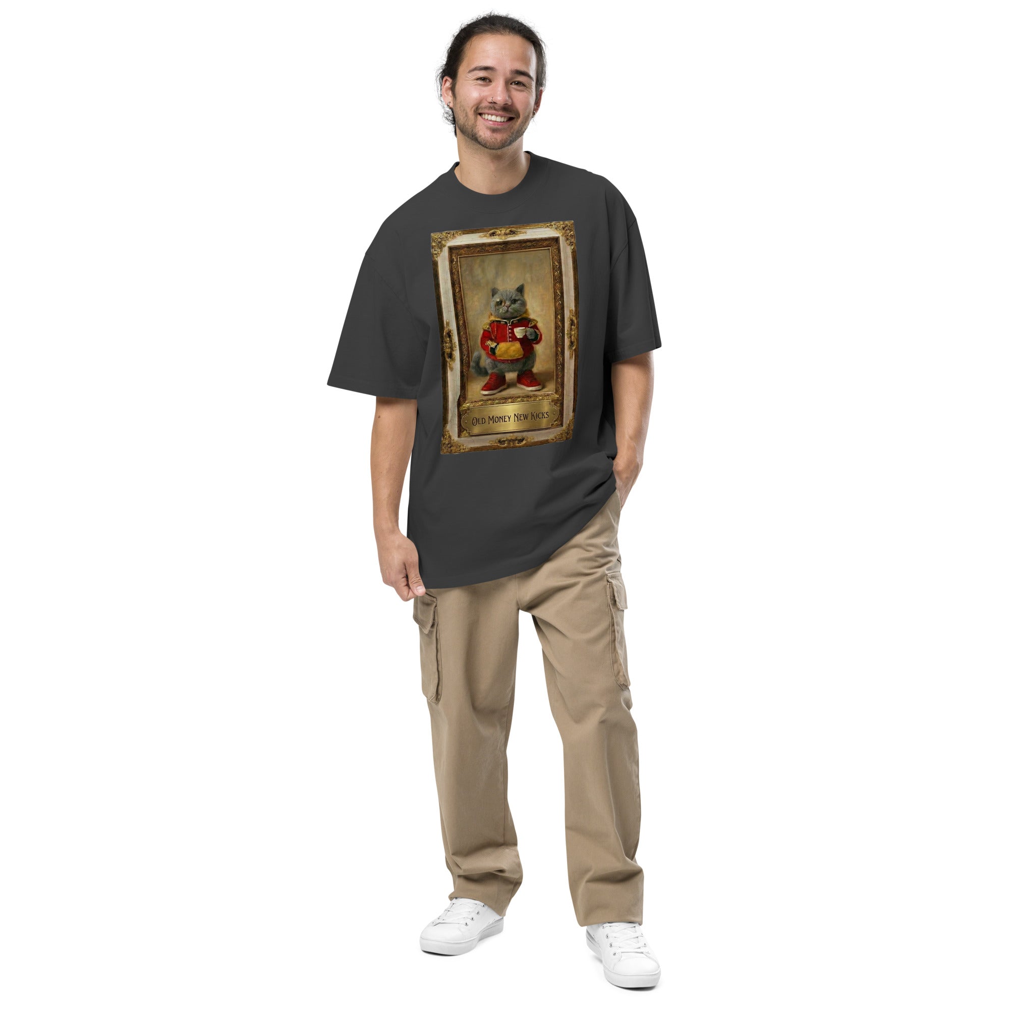 Model wearing black oversized faded tee with vintage portrait graphic, studio view