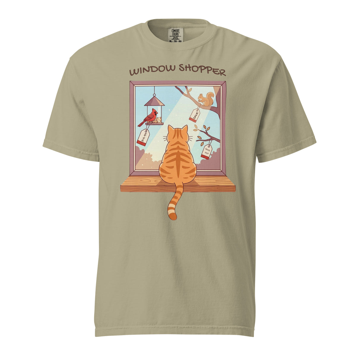 Khaki Window Shopper tee: orange tabby on a windowsill eyeing a tagged cardinal and squirrel