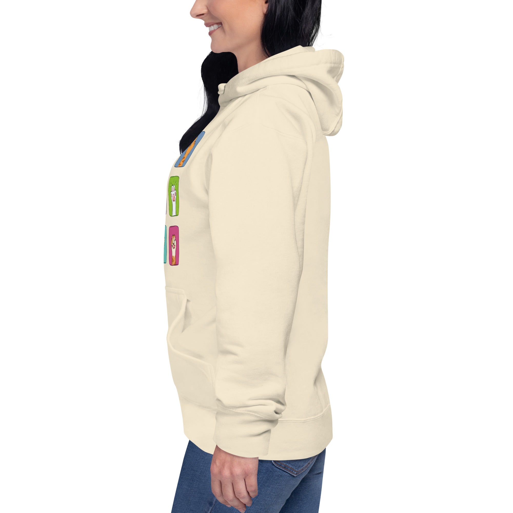 Model wearing cream hoodie, left side view