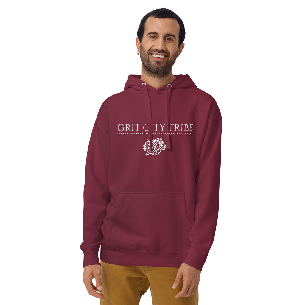 Man wearing maroon Grit City Tribe hoodie with tribal lion duo graphic and serif lettering