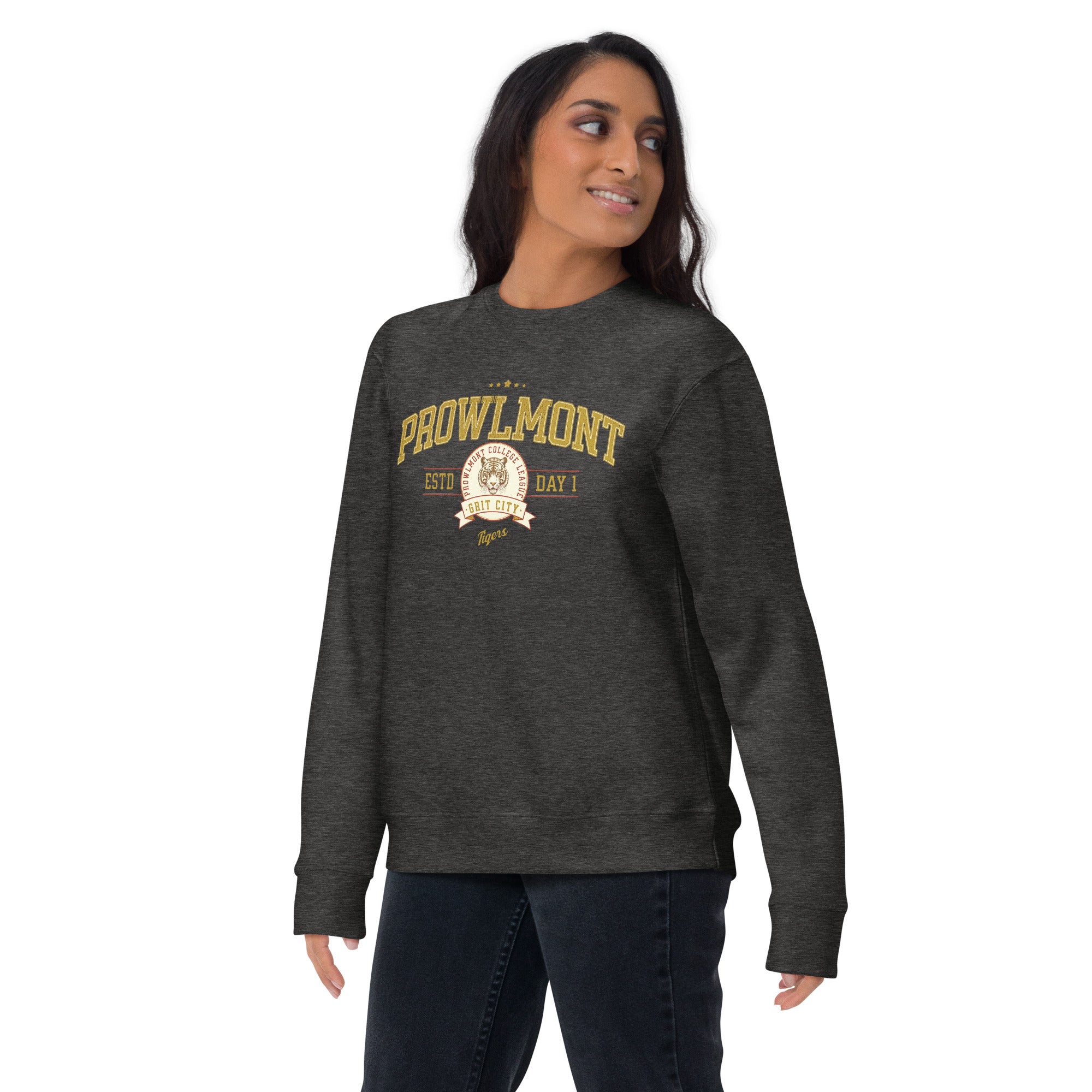 Woman wearing a gray varsity style sweatshirt with yellow 'Prowlmont Grit City Tigers' text and tiger logo on a white background