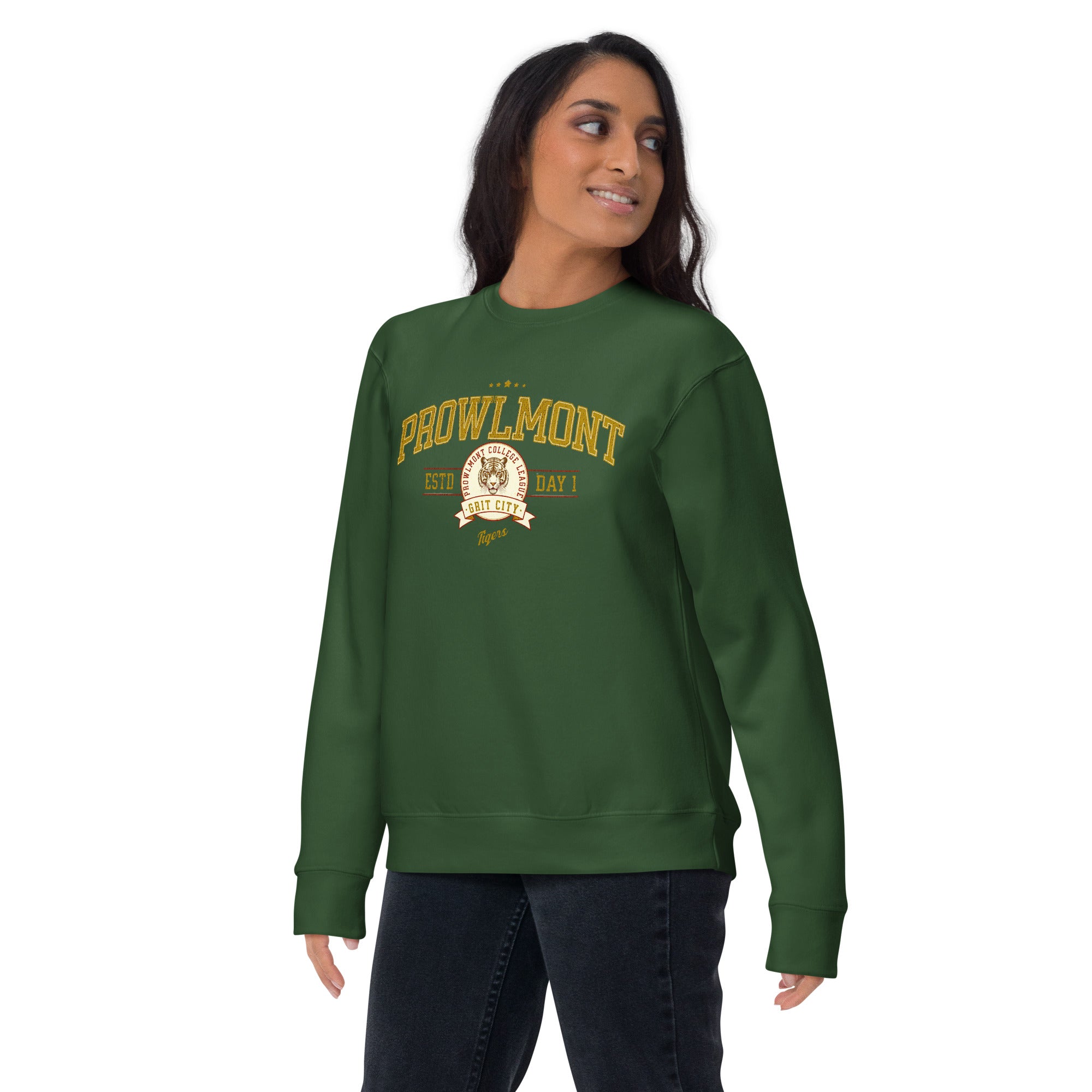 Woman wearing a green varsity style sweatshirt with yellow 'Prowlmont Grit City Tigers' text and tiger logo on a white background