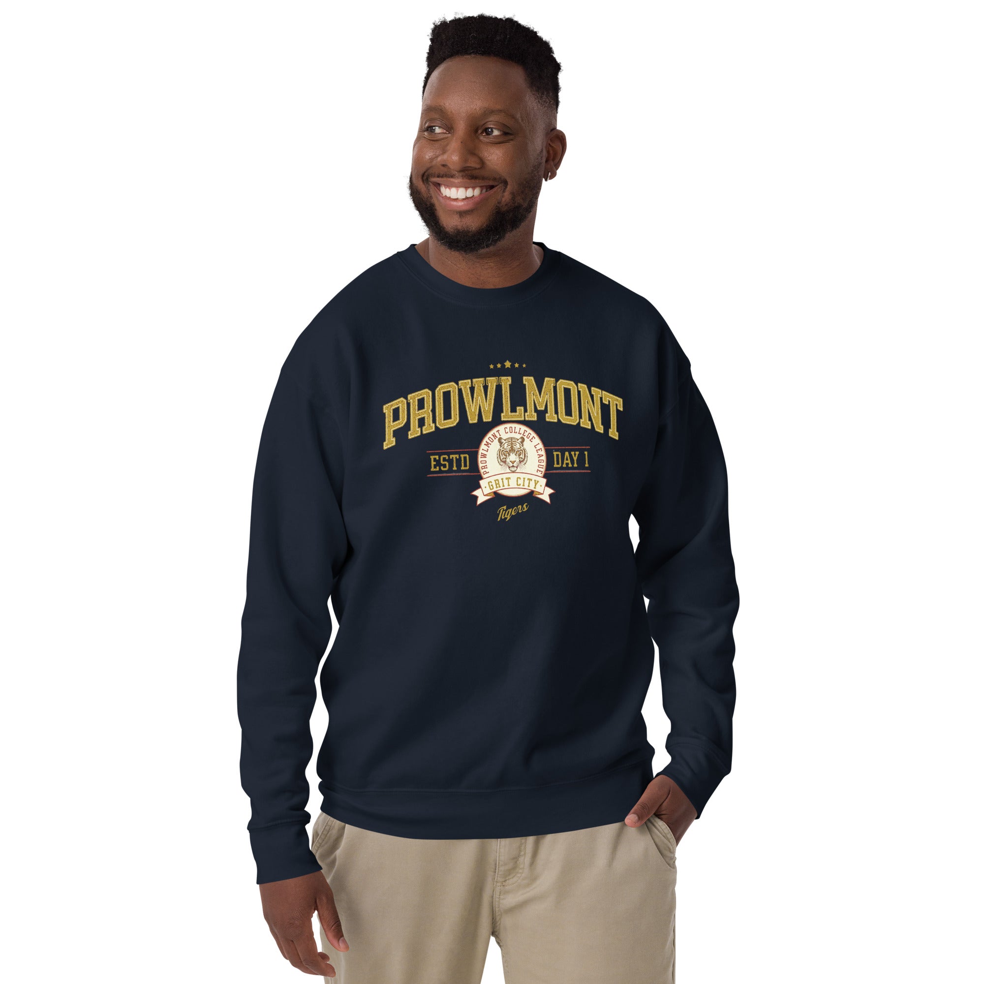 Man wearing a navy blue varsity style sweatshirt with yellow 'Prowlmont Grit City Tigers' text and tiger logo on a white background