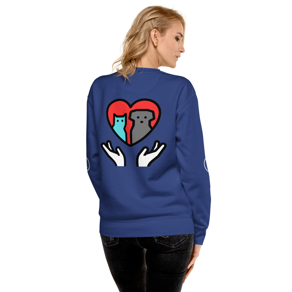 Back of sweatshirt: Graphic depicts two hands holding up a cat and a dog together inside a heart.