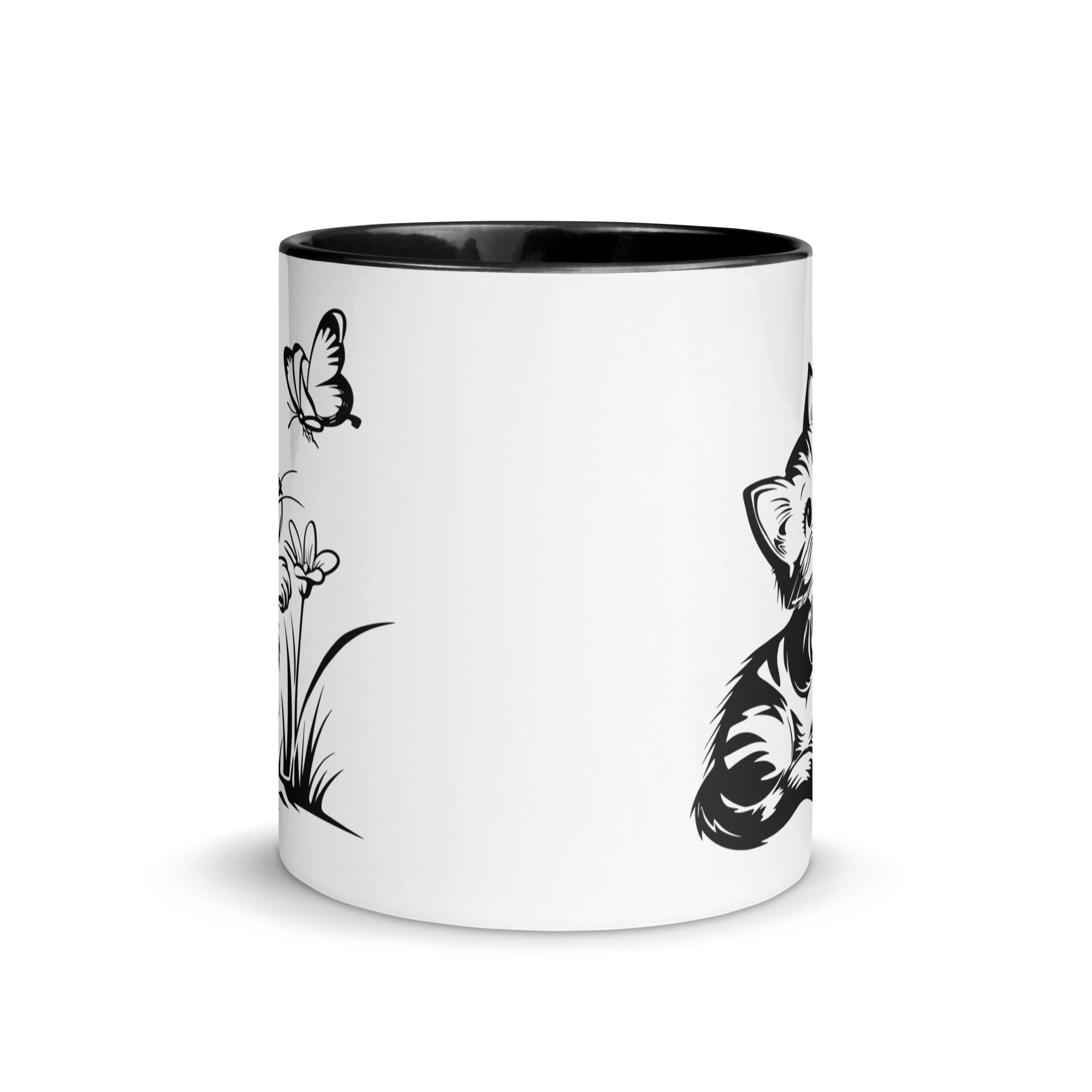 A white and black mug featuring a line art design of a playful encounter between a curious kitten and a gentle butterfly