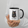 White "Too Much" Mug (showing interior and handle): Graphic of a wide-eyed/red-eyed gray cat pouring overflowing coffee into a cup, with coffee spilling down the side.