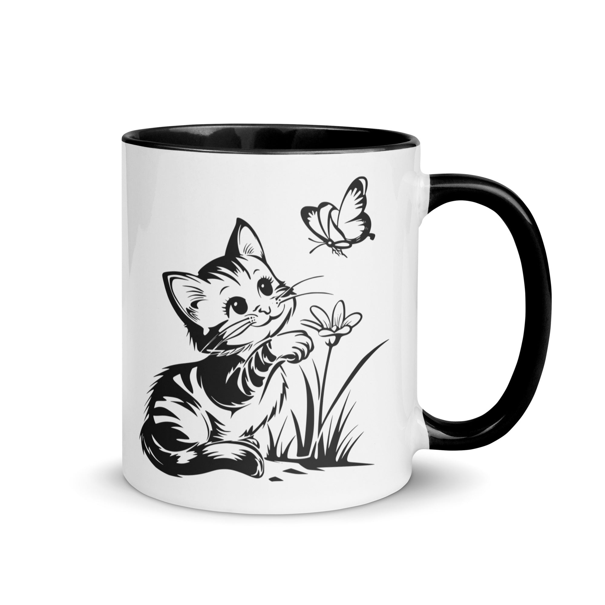 A white and black mug featuring a line art design of a playful encounter between a curious kitten and a gentle butterfly