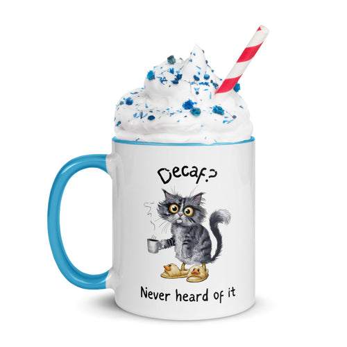 A white and light blue mug featuring an exhausted looking cat wearing yellow slippers with duck faces on them. The cat is holding a steaming mug of coffee.  The text on the mug reads "Decaf? Never Heard of It."